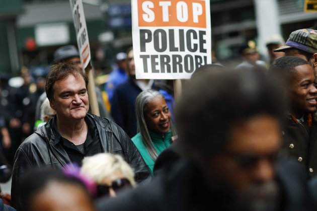 US film director Quentin Tarantino (L) takes part in a march against police brutality called "Rise up October" on October 24, 2015, in New York. Campaigners demanding an end to police killings of unarmed suspects demonstrated and marched through Manhattan. AFP PHOTO/EDUARDO MUNOZ ALVAREZ (Photo credit should read EDUARDO MUNOZ ALVAREZ/AFP/Getty Images)