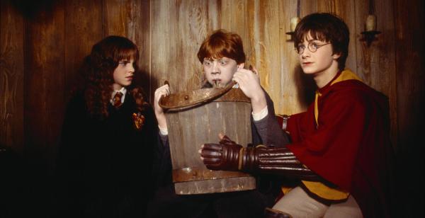 Hermione-Emma-Watson-left-and-Harry-Daniel-Radcliffe-right-watch-as-Ron-Rupert-Grint-spits-up-a-slug-in-Harry-Potter-and-The-Chamber-of-Secrets-2002-49