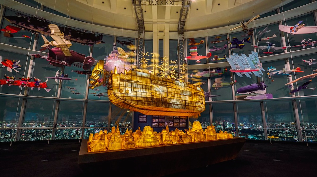 Maquette flottante studio Ghibli de nuit éclairée