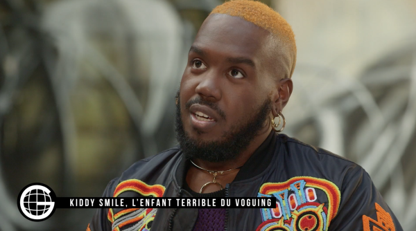 Kiddy Smile est l’un des plus éminents représentants du voguing en France. Producteur et dj, son EP Enough of You et son clip « Let a Bitch Know » sont de véritables masterpieces de house. Attaché à la subversion du voguing, Kiddy Smile œuvre à l’adaptation de ce mouvement né dans les années 1960 à New York sur la scène française. À l’intersection de la lutte contre le racisme, la transphobie et l’homophobie, le voguing représente un espace de liberté et de solidarité pour bon nombre de jeunes français.