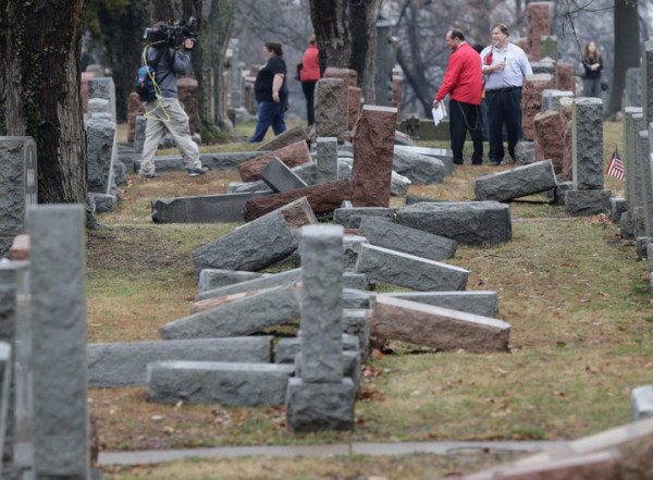 Local and national media report on more than 170 toppled Jewish headstones after a weekend vandalism attack on Chesed Shel Emeth Cemetery in University City, a suburb of St Louis, Missouri, U.S. February 21, 2017.  REUTERS/Tom Gannam