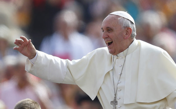 Pope Francis greets pilgrims as he arrives to lead his general audience in St. Peter's Square at the Vatican Sept. 11. (CNS photo/Paul Haring) (Sept. 11, 2013) See POPE-AUDIENCE Sept. 11, 2013.